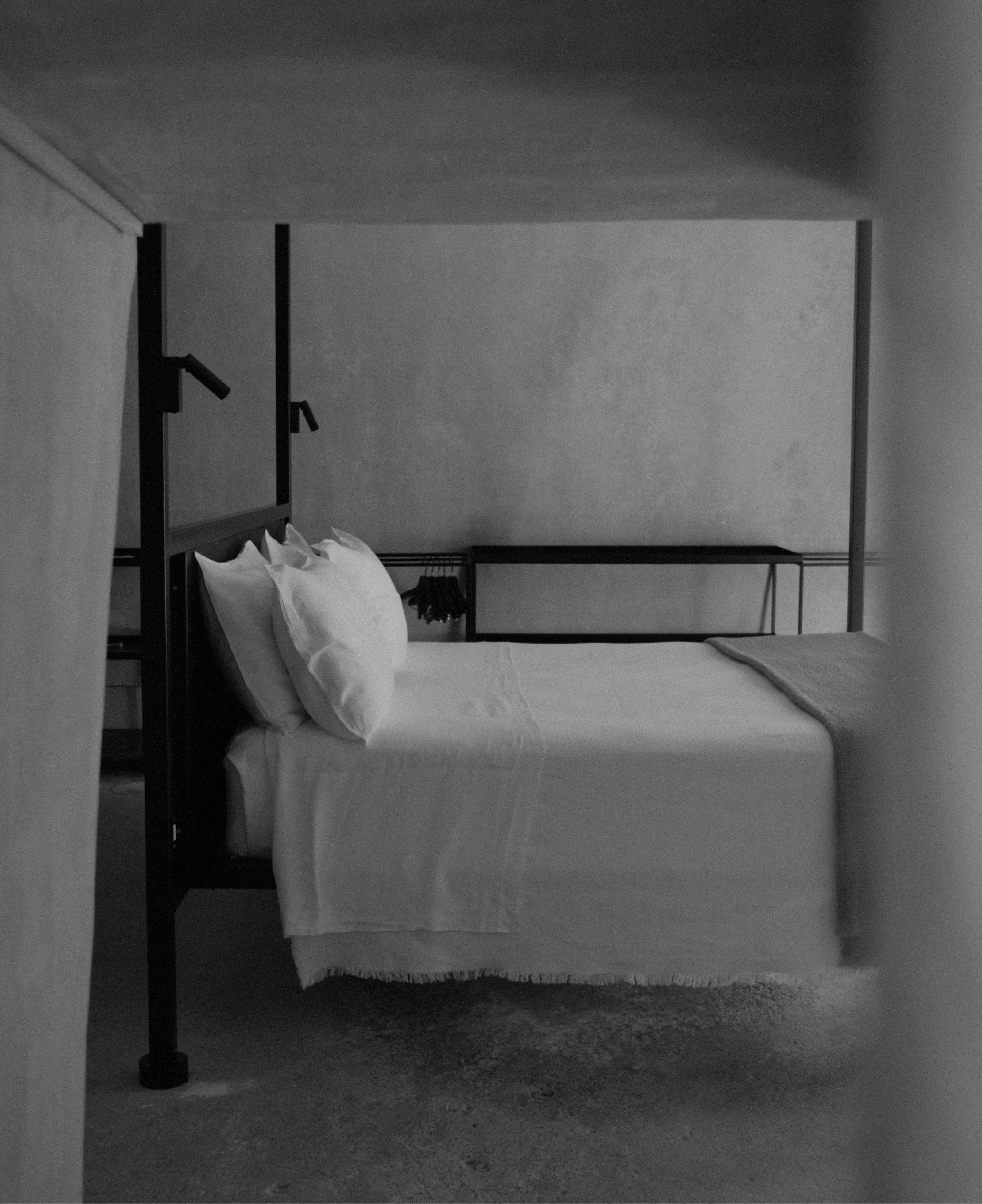 A design-led hotel interior, softly lit.